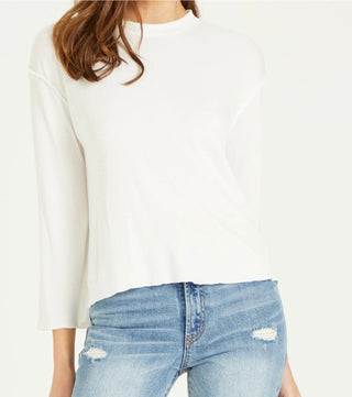 woman with white long sleeve top