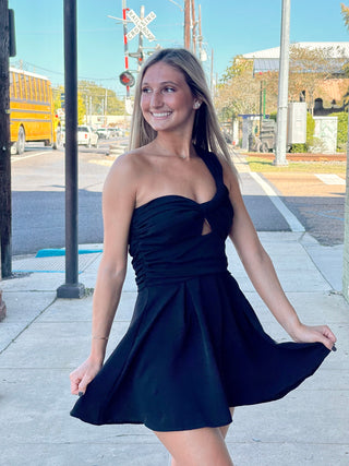 black one shoulder flowy romper with asymmetrical top.