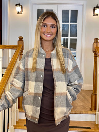 Gray and tan jacket with silver buttons