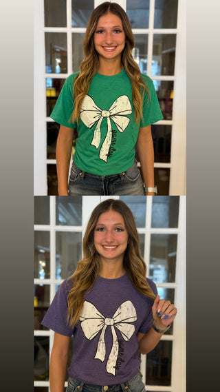 Two images of a person wearing green and purple t-shirts with a white bow design.