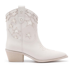 A white boot with silver star patterns and a low heel.