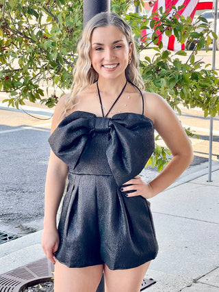 A black bow romper