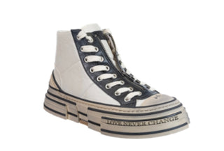 A pair of Rebecca White Divergent Ivory Black sneakers with lace-up closure and a white sole with black text reading 'LOVE NEVER CHANGES'.