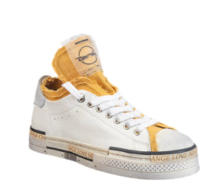 A ivory sneaker with accents of yellow