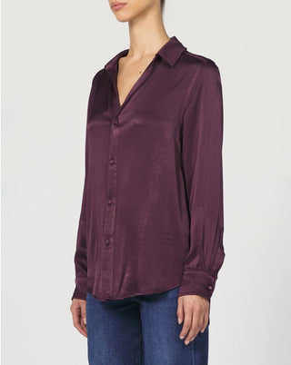 Woman wearing silk fig colored long sleeve top