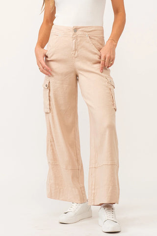 Beige cargo pants worn by a person on a white background