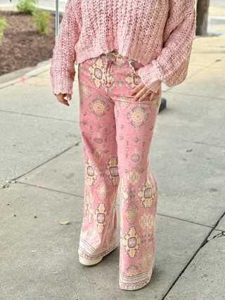 Woman wearing pattern pink pants with pink sweater