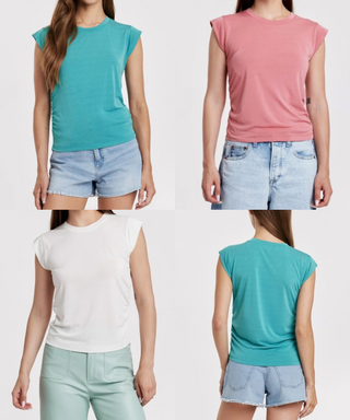 Four different colored t-shirts worn by a person with denim shorts on a white background