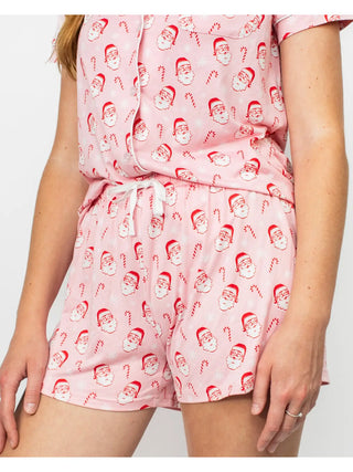 Pink pajama set with Santa Claus pattern on a white background