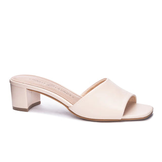 A small cream heel with white background.