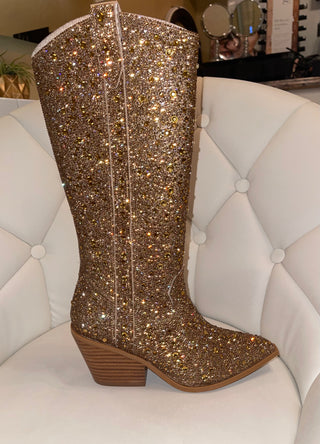 A glittery gold rhinestone-studded boot designed for women's fashion.