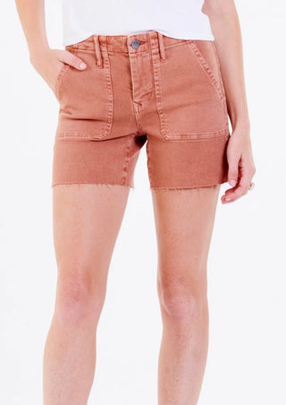 A pair of beige denim shorts with a high-waist and a five-pocket design, displayed on a model.
