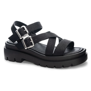 Black strappy sandal with two silver buckles with white background.
