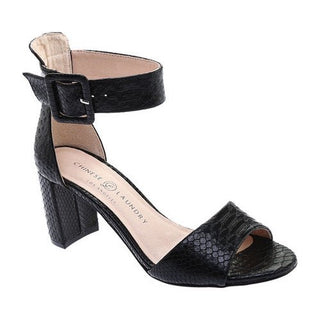 Black snake textured heels with thick strap that wraps around ankle