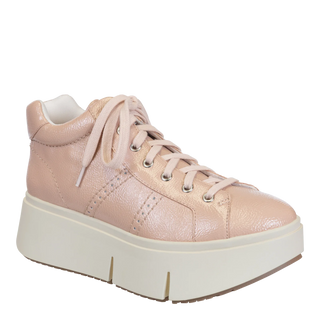 A pink leather sneaker with lace-up closure and a thick white sole.