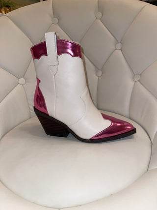 A white cowboy boot with metallic pink accents.