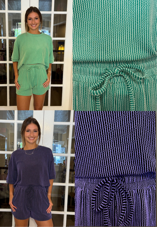 Two people wearing green and purple outfits with close-up ribbed details of fabric texture.