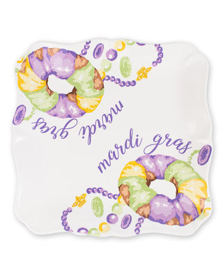 Mardi Gras-themed decorative platter with beads and doubloons on a white background
