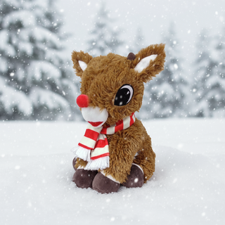 Rudolph plush sitting in the snow