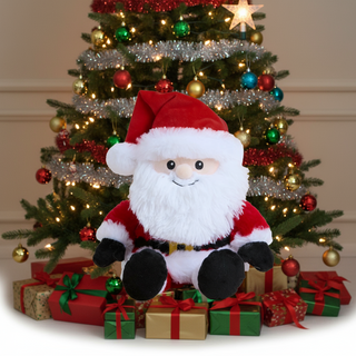 Plush Santa Claus toy in front of a decorated Christmas tree with presents.