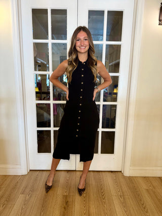 A black bodycon sweater dress with buttons on the front￼