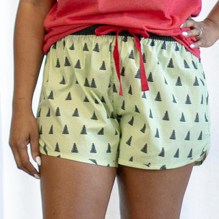 Light green shorts with dark green Christmas trees and red drawstring
