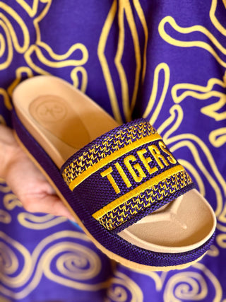 Purple and gold slide sandal with 'TIGERS' text against a purple background