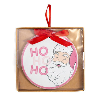White and pink Santa ornament that says “ HO HO HO”