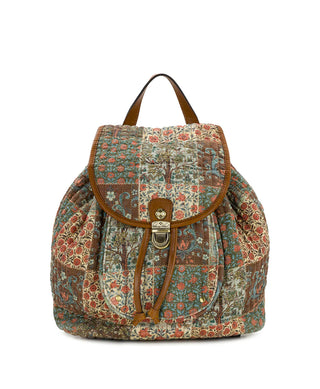 A vintage-style patchwork quilted backpack with brown leather trim, a drawstring closure, and a gold-tone metal clasp, shown against a plain white background.