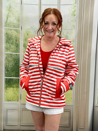 Red and white striped rain coat paired with white shorts