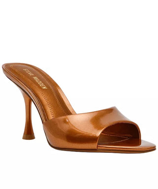 A metallic bronze high-heeled mule sandal with an open toe, shown from a three-quarter angle on a plain white background. The brand name 'STEVE MADDEN' is printed on the insole.