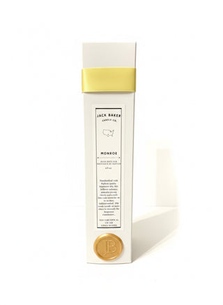 White package with yellow ribbon on a white background 