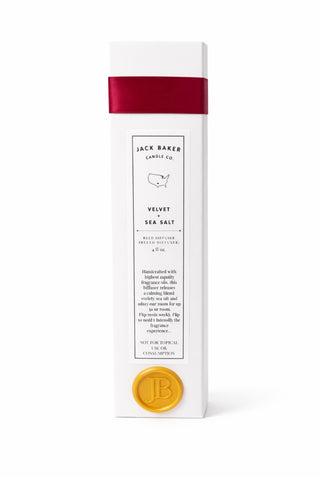 White box with maroon ribbon and gold stamp that says ‘JB’