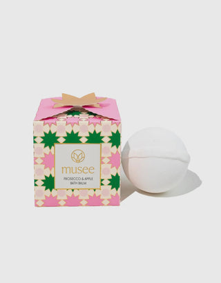 Musee bath balm with a colorful box on a white background