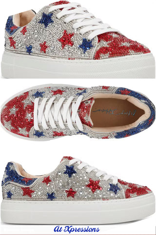 Sneakers with red, blue, and silver star patterns on a white background