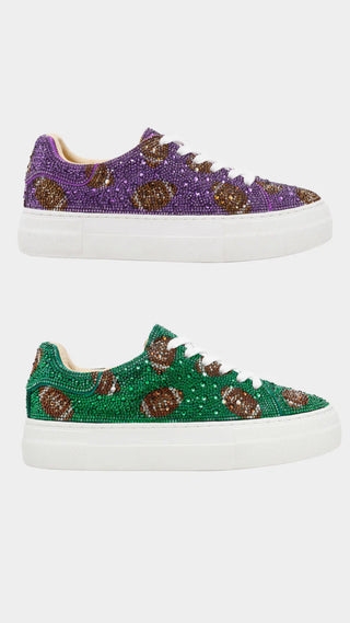 Purple and green sneakers with decorative elements on a white background