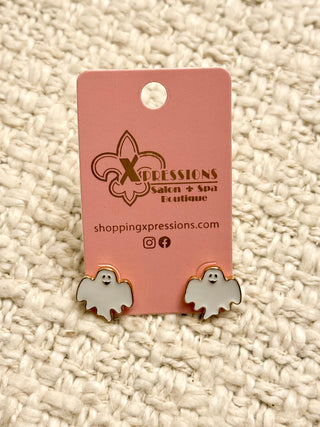 Ghost-shaped earrings on a pink Xpressions branded card against a textured beige background