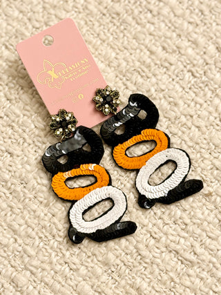 A pair of "BOO" sequin earrings