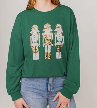 Green sweatshirt with three sequin nutcrackers 