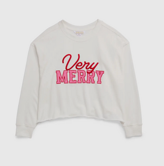 White sweatshirt with pink and red writing that says “very merry”