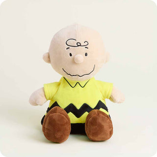 Plush toy resembling a character with a yellow shirt and brown pants on a white background